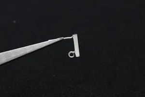Macro shot of S925 sterling silver rectangular stud earrings with DIY loops for jewelry