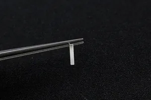 Macro shot of S925 sterling silver rectangular stud earrings held by metal tweezers