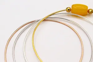 Detailed view of DIY S925 silver screw bangles in gold, silver, and rose gold finishes