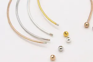 Detail of DIY S925 silver bangles showing screw ends and small beads in three metal colors