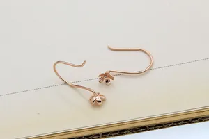 Detail view of rose gold S925 sterling silver flower petal earring hooks for DIY jewelry
