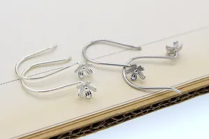 Macro shot of S925 sterling silver petal flower ear hooks for DIY earring making