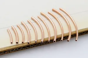 Macro shot of rose gold plated S925 sterling silver curved tubes in various lengths