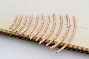 Set of 12 rose gold curved tube spacers for DIY bracelet making in gradient lengths