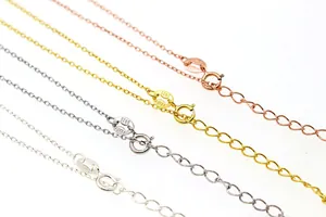 Detail of S925 sterling silver cross chains with Italy hallmark in four metallic finishes