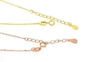Macro detail of S925 sterling silver chain with spring clasp and engraved hallmark tag