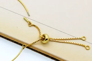 Macro detail of high-polish gold sliding clasp for DIY adjustable jewelry making
