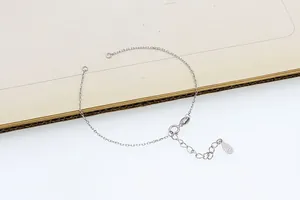 Detailed view of S925 sterling silver cross chain bracelet with spring clasp and tag