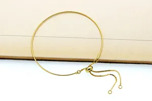 Detailed view of adjustable golden S925 sterling silver slider bracelet with pull chain