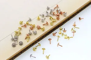 Detail of S925 silver DIY star and round bead stoppers in gold and rose gold finishes