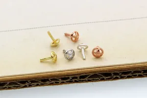 Macro view of S925 sterling silver hollow hemisphere beads in gold and silver finishes