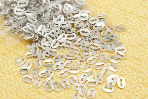 Macro detail of oval S925 sterling silver connector tags with Italy hallmark engraving