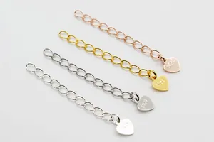 Macro shot of S925 sterling silver extension chains with heart charms in varied plating colors