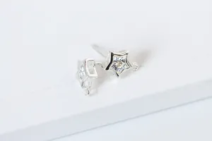 Detailed macro view of S925 sterling silver star stud earrings with zircon and DIY loop