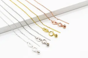 Macro shot of S925 sterling silver chain necklaces with Italy hallmark on white display