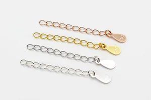 Detail of four S925 sterling silver extender chains in gold, rose gold and silver finishes