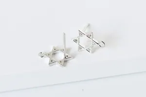 Macro shot of S925 sterling silver hexagram ear studs with cubic zirconia and DIY loop