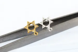 Macro detail of gold and silver S925 sterling silver star charms for jewelry making