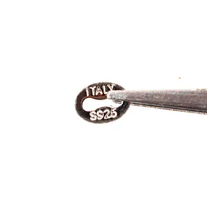 Macro shot of S925 sterling silver oval tag connector with ITALY engraving for jewelry