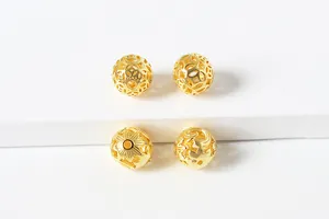 Macro view of S925 sterling silver hollow beads with intricate coin and floral patterns