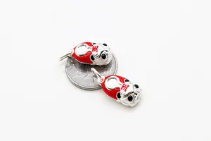 Detailed macro view of S925 silver zodiac tiger pendants with red enamel finish