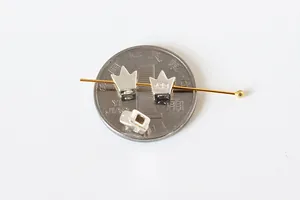 Macro shot of S925 sterling silver crown charms for DIY jewelry making accessories