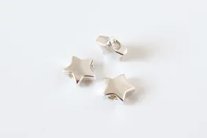Macro shot of silver S925 geometric star spacer bead with center hole for DIY jewelry making