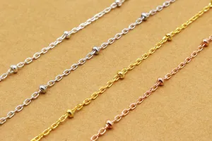 Macro detail of S925 silver satellite chains in silver gold and rose gold finishes