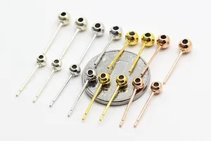 Macro shot of S925 sterling silver ball head earrings studs in silver gold and rose gold