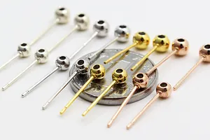 Macro view of S925 sterling silver ball head ear studs in gold, silver, and rose gold