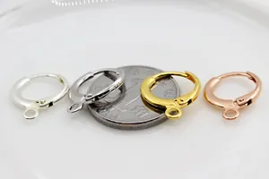 Macro detail showing S925 sterling silver DIY earring clasps in four metallic colors