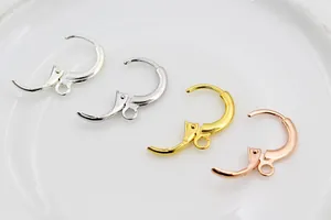 Macro shot of S925 sterling silver leverback earrings in silver, gold, and rose gold