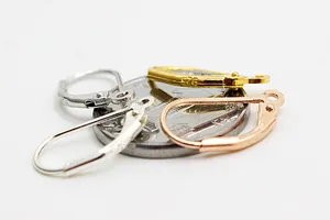 Macro detail of S925 sterling silver lever-back earring hooks with hallmark engraving