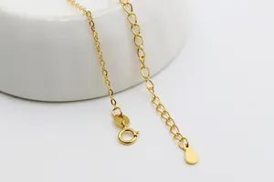 Detailed macro view of S925 sterling silver gold-plated O-chain with spring ring clasp