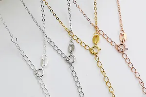 Macro detail of S925 sterling silver chain clasps and adjustable links in four colors