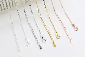 Detail of S925 sterling silver extender chains with spring clasps in gold and rose gold