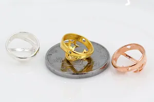 Macro detail of S925 sterling silver hollow star rings in gold, silver and rose gold