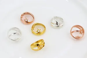 Detailed macro view of S925 sterling silver hollow star beads in gold and rose gold