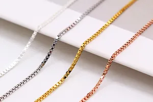 Macro view of four-color S925 sterling silver box chains with polished square links
