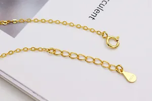 Detail of S925 sterling silver golden O-chain extender with spring clasp and hallmark