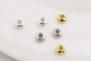 Macro view of gold and silver S925 sterling silver spacer beads for DIY jewelry making