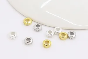 Macro detail of S925 sterling silver wheel spacer beads with pavé cubic zirconia accents