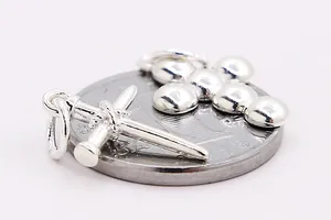 Macro detail of S925 sterling silver cross and sword pendants with metallic luster