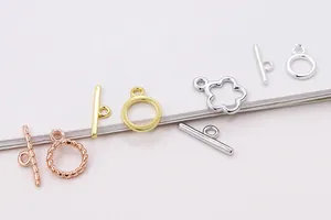 Macro view of S925 sterling silver flower and twist OT toggles in gold, rose gold and silver