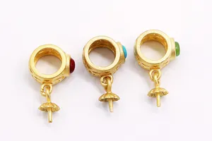 Macro detail of S925 sterling silver gold plated pendant clasps with colorful gemstones