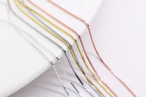 Detailed view of S925 sterling silver box chains in silver, gold, and rose gold finishes
