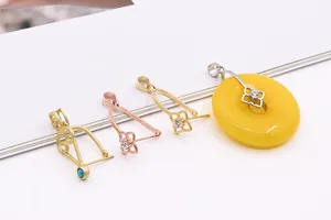 Macro detail of S925 silver four-leaf clover pendant clips for jewelry DIY and jade matching