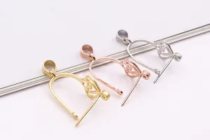 Macro shot of S925 sterling silver heart pendant connectors in gold, rose gold and silver