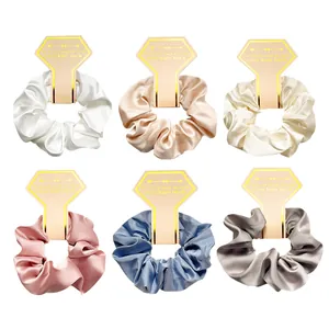 6-pack of premium silk satin scrunchies in elegant neutral colors on display cards