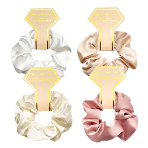 Four-pack satin hair scrunchies on display cards for weddings and bridal parties